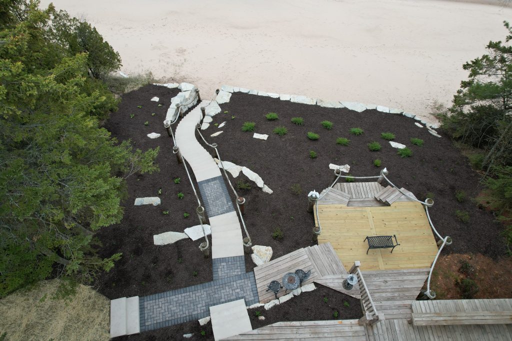 Aerial view of a wooden deck and walkway as a part of a landscape design in Green Bay, WI.